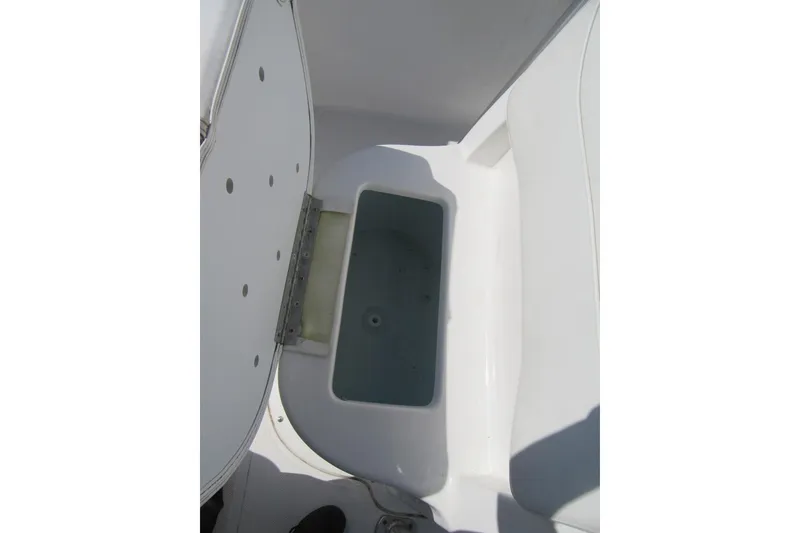 Slide: The Image of Open storage compartment on 2013 Sea Hunt Ultra 211 boat. - 12