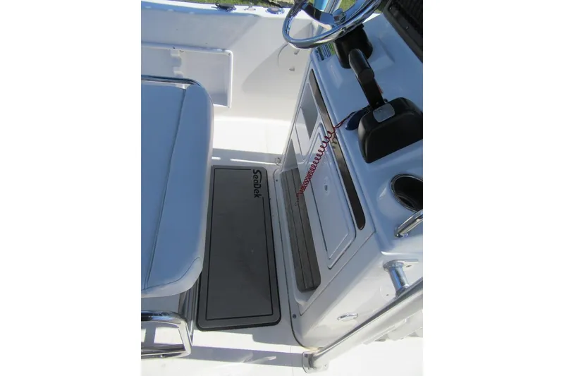 Slide: The Image of Interior view of a 2013 Sea Hunt Ultra 211 boat console and seating area. - 20