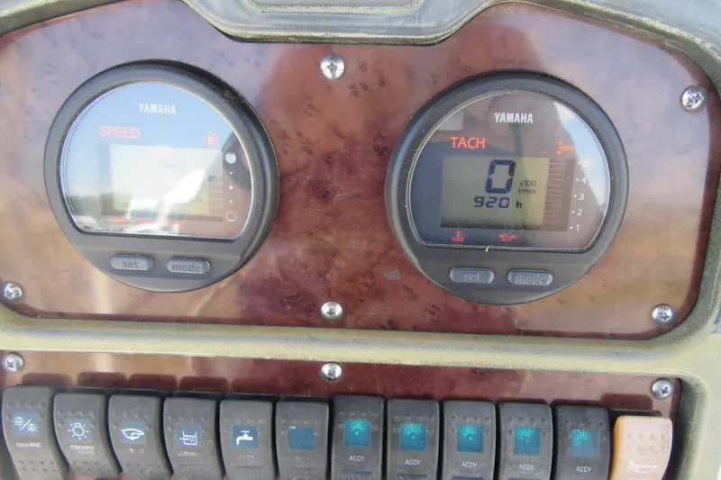 Slide: The Image of Dashboard of a 2013 Sea Hunt Ultra 211 boat with Yamaha gauges and switches. - 22