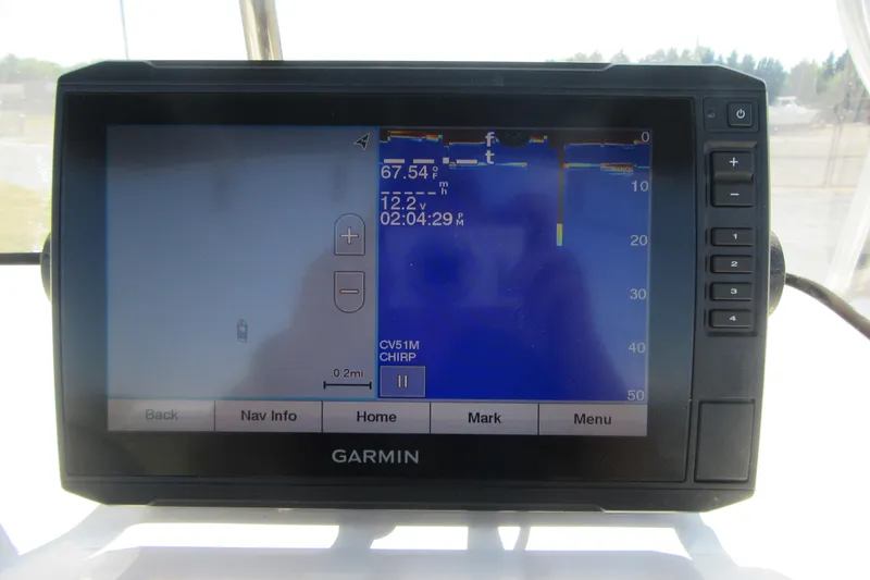 Slide: The Image of Garmin marine GPS display on 2013 Sea Hunt Ultra 211 boat dashboard. - 24