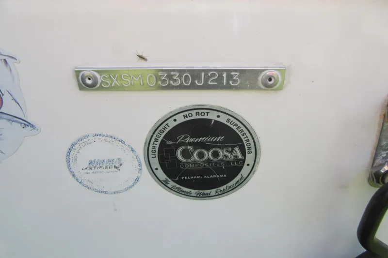 Slide: The Image of 2013 Sea Hunt Ultra 211 boat with Coosa Composites label and serial number. - 4