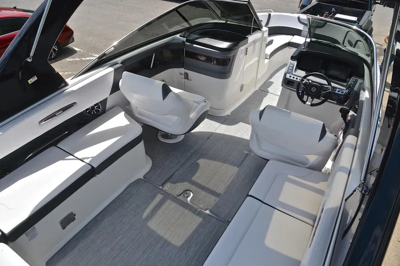 Slide: The Image of 2018 Chaparral 287 SSX boat interior with sleek seating and modern dashboard. - 20