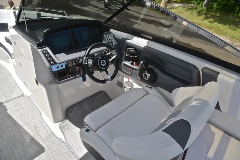 Slide: The Image of Interior cockpit of 2018 Chaparral 287 SSX boat with modern steering and controls. - 27