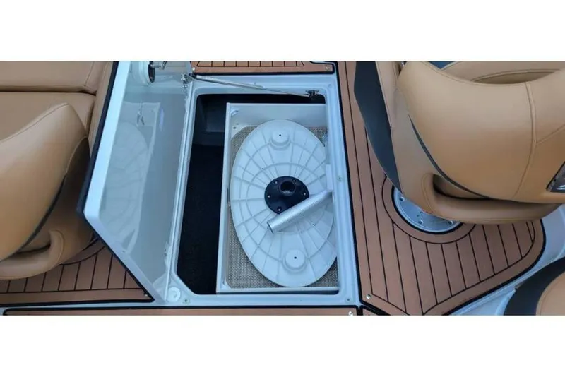 Slide: The Image of 2024 Crownline Eclipse E235 boat storage compartment with teak flooring and tan seating. - 15