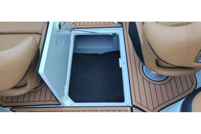 Slide: The Image of 2024 Crownline Eclipse E235 boat storage compartment with tan seating and wood-style flooring. - 16