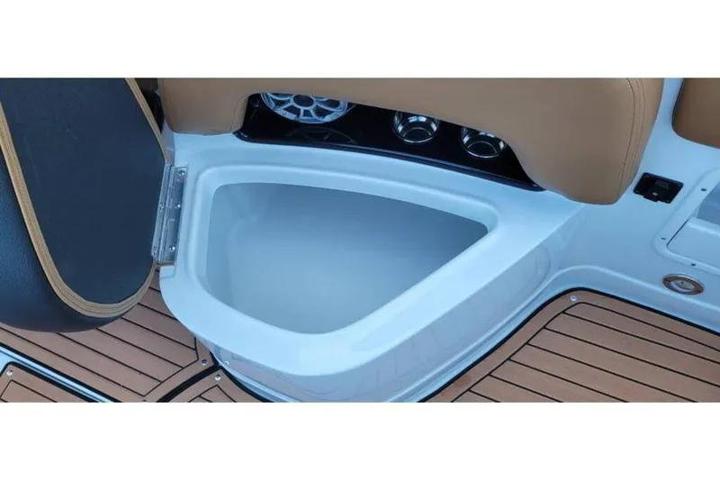 Slide: The Image of 2024 Crownline Eclipse E235 boat interior storage compartment with teak flooring. - 18