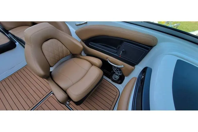 Slide: The Image of 2024 Crownline Eclipse E235 interior with tan leather seating and sleek design. - 22