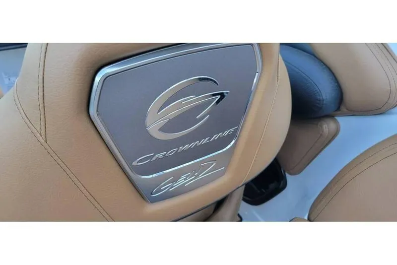 Slide: The Image of 2024 Crownline Eclipse E235 boat seat with logo and tan upholstery. - 23
