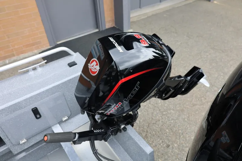 Slide: The Image of Outboard motor on a 2025 Thunder Jet 209 Rush OT boat, featuring sleek black design. - 13