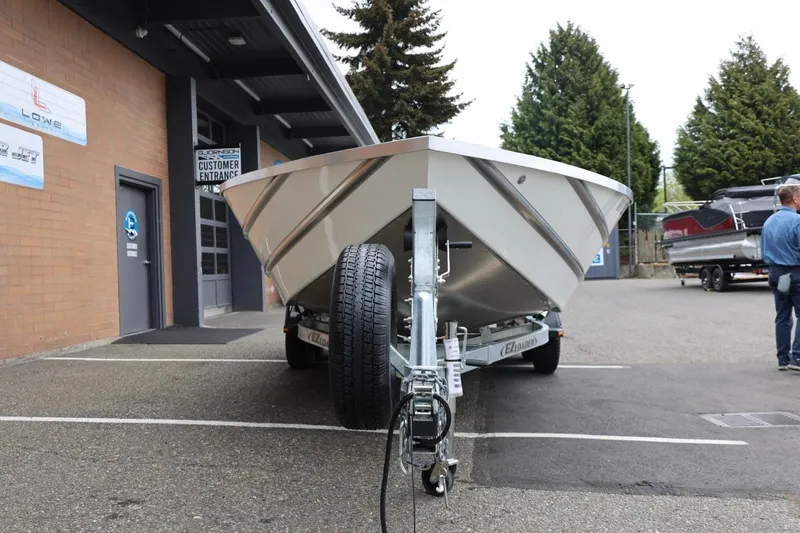 Slide: The Image of 2025 Thunder Jet 209 Rush OT boat on trailer outside dealership. - 28