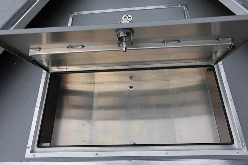 Slide: The Image of Open storage compartment of 2025 Thunder Jet 209 Rush OT boat. - 34