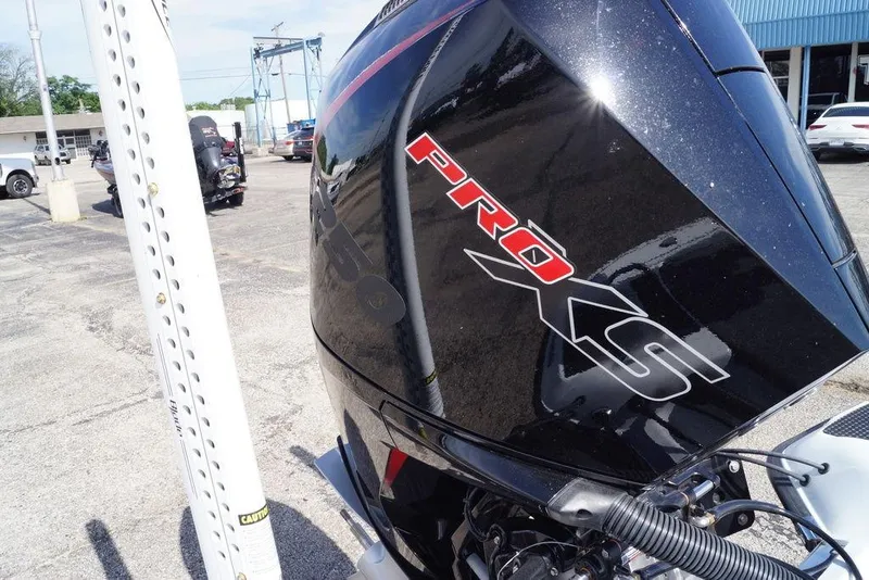 Slide: The Image of 2026 Phoenix 721 ZXL boat with Pro XS engine in parking lot. - 12