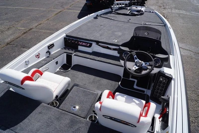 Slide: The Image of 2026 Phoenix 721 ZXL boat interior with steering wheel and seating. - 16
