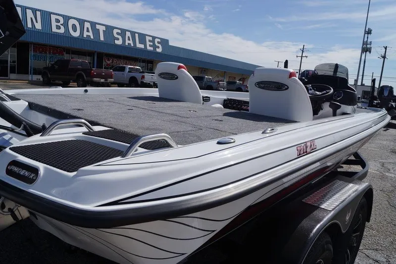Slide: The Image of 2026 Phoenix 721 ZXL boat displayed at a dealership, showcasing sleek design and features. - 8