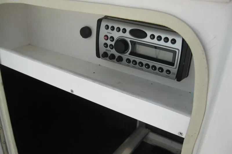 Slide: The Image of 2006 Sea Ray 240 Sundeck stereo system with control panel and display. - 18