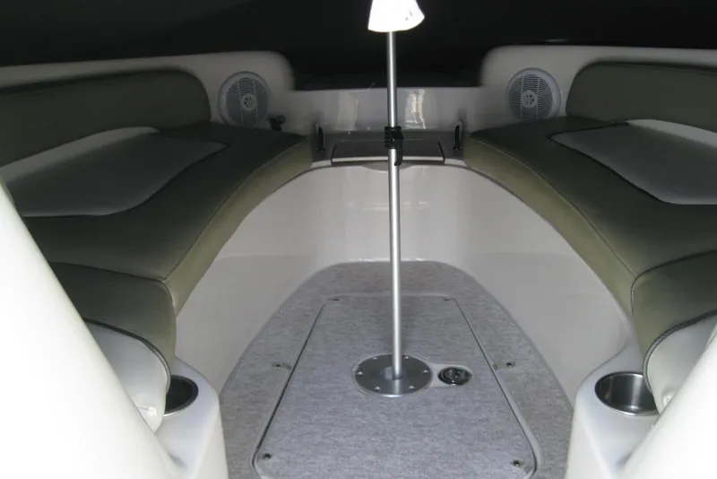 Slide: The Image of Interior view of a 2006 Sea Ray 240 Sundeck boat with cushioned seating. - 20