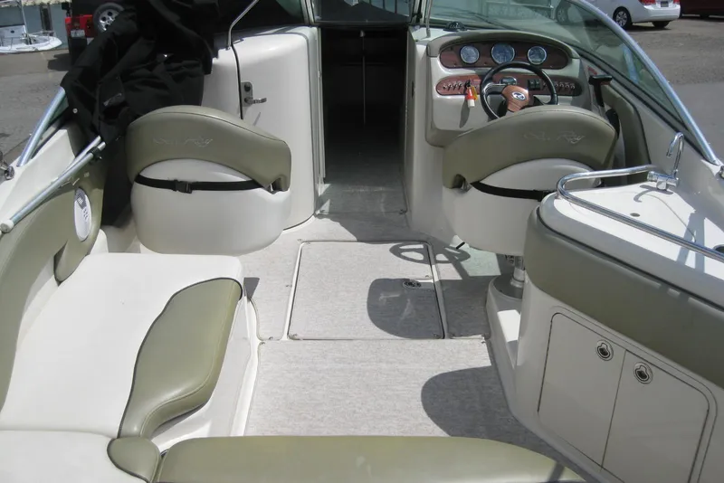 Slide: The Image of Interior view of a 2006 Sea Ray 240 Sundeck boat with seating and dashboard. - 9
