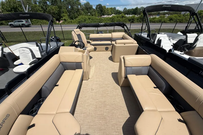 Slide: The Image of 2023 Harris Cruiser 230 pontoon boat with spacious seating and modern design. - 3