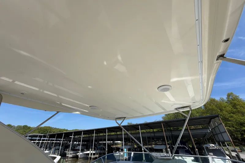Slide: The Image of 2001 Maxum 4600 SCB Limited Edition yacht canopy with marina background. - 12