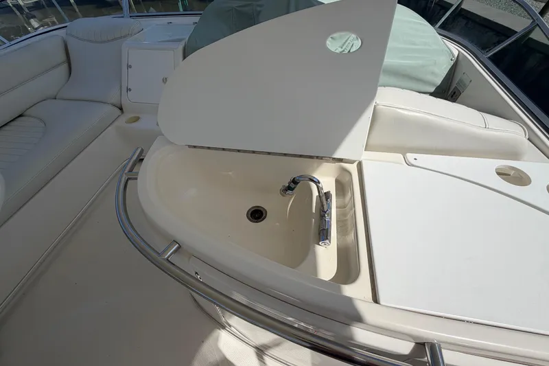 Slide: The Image of 2001 Maxum 4600 SCB Limited Edition yacht sink and seating area. - 13