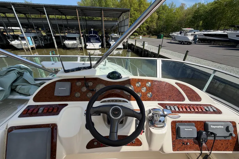 Slide: The Image of Helm of 2001 Maxum 4600 SCB Limited Edition yacht with Raymarine navigation system. - 15