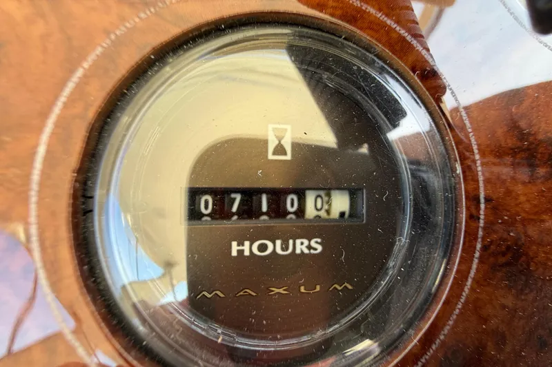 Slide: The Image of Hour meter showing 710 hours on 2001 Maxum 4600 SCB Limited Edition. - 16