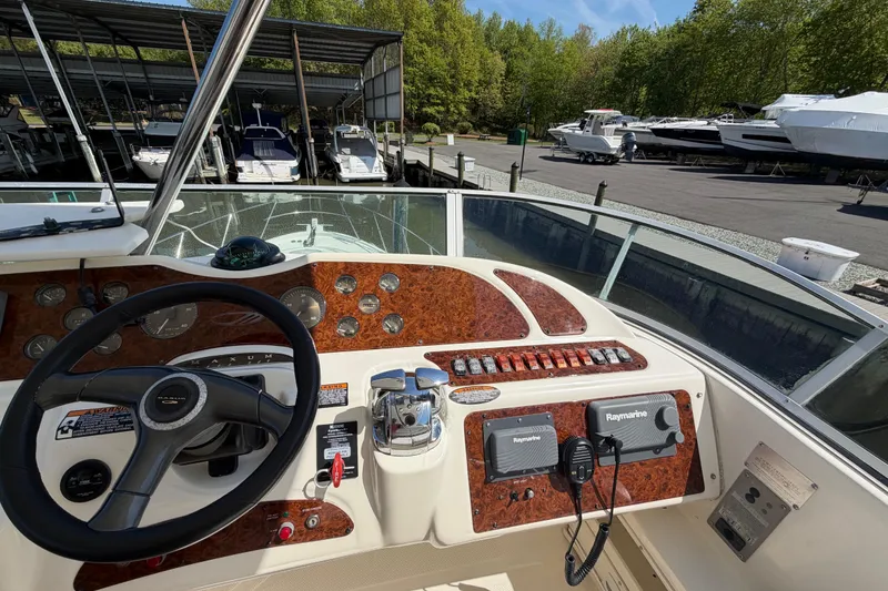 Slide: The Image of 2001 Maxum 4600 SCB Limited Edition yacht helm with steering wheel and navigation controls. - 19