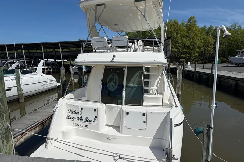Slide: The Image of 2001 Maxum 4600 SCB Limited Edition yacht docked at marina. - 2