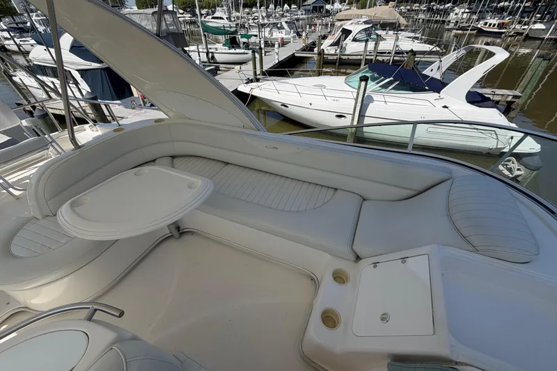 Slide: The Image of Luxurious seating area on a 2001 Maxum 4600 SCB Limited Edition yacht at a marina. - 21