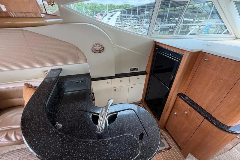 Slide: The Image of Luxurious 2001 Maxum 4600 SCB yacht interior with modern kitchen and sleek design. - 27