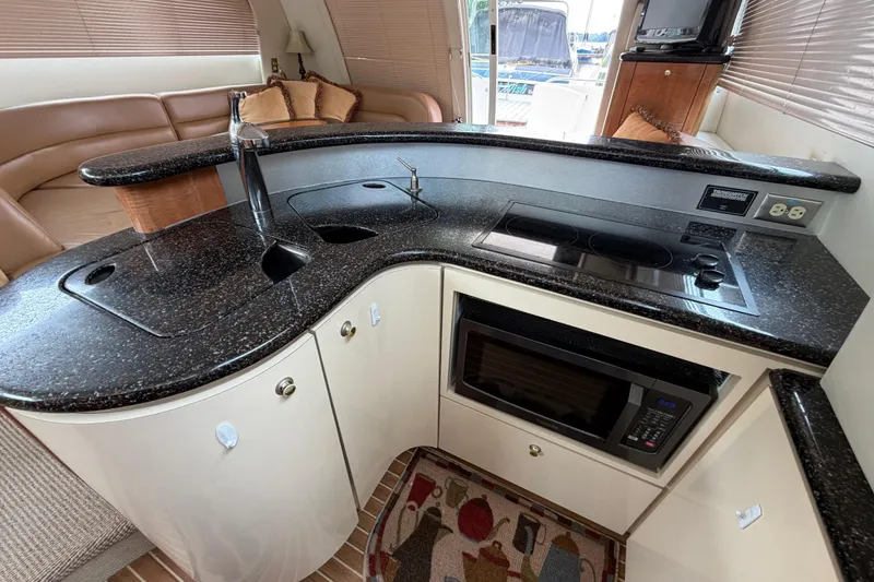 Slide: The Image of Luxurious kitchen interior of 2001 Maxum 4600 SCB yacht with modern appliances. - 28