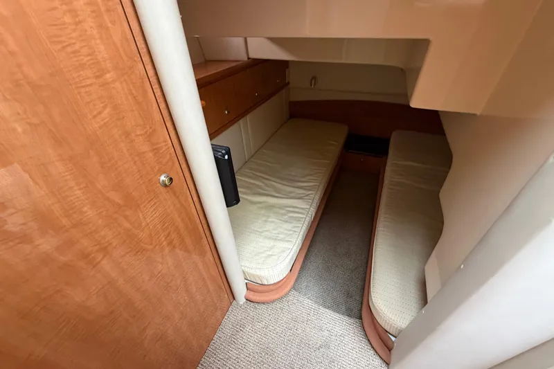 Slide: The Image of 2001 Maxum 4600 SCB Limited Edition cabin with twin beds and wooden cabinetry. - 32
