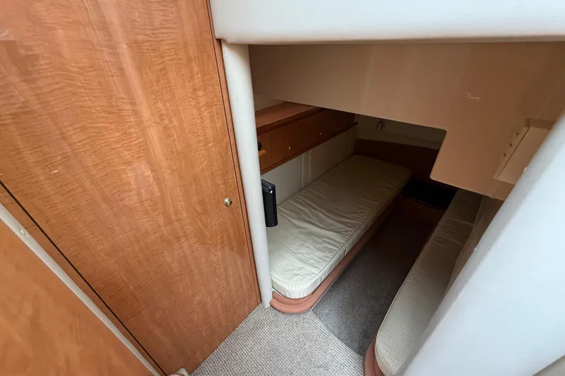 Slide: The Image of 2001 Maxum 4600 SCB Limited Edition cabin with twin beds and wooden cabinetry. - 33