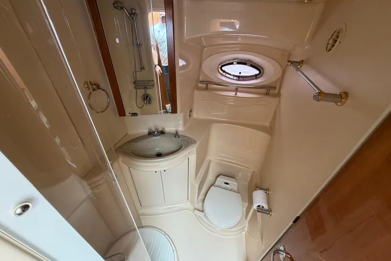 Slide: The Image of Bathroom interior of 2001 Maxum 4600 SCB Limited Edition yacht, featuring sink and toilet. - 34