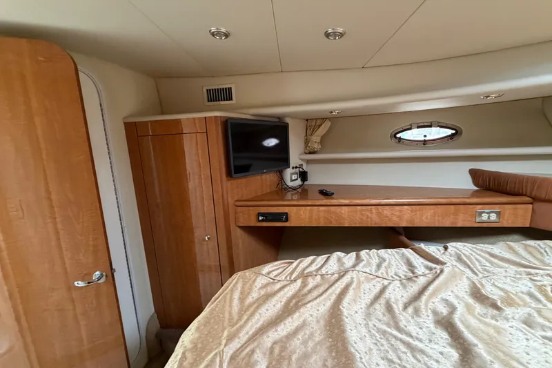 Slide: The Image of Luxurious cabin interior of 2001 Maxum 4600 SCB Limited Edition yacht with wood finishes. - 36