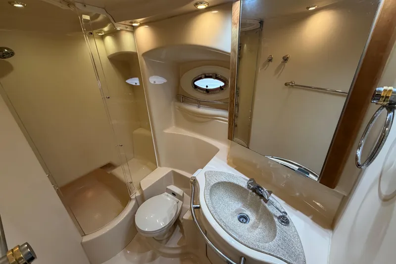 Slide: The Image of Luxurious bathroom in 2001 Maxum 4600 SCB yacht with shower, sink, and toilet. - 37