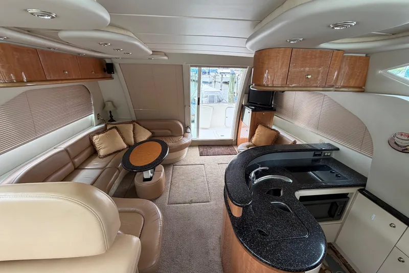 Slide: The Image of Luxurious interior of 2001 Maxum 4600 SCB yacht with modern kitchen and seating area. - 39