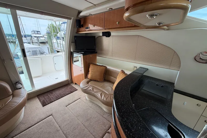 Slide: The Image of Interior of 2001 Maxum 4600 SCB yacht with seating, TV, and kitchenette. - 41
