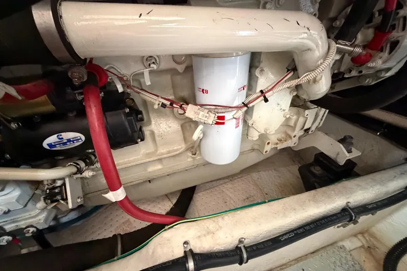 Slide: The Image of Engine compartment of 2001 Maxum 4600 SCB Limited Edition with visible filter and hoses. - 43