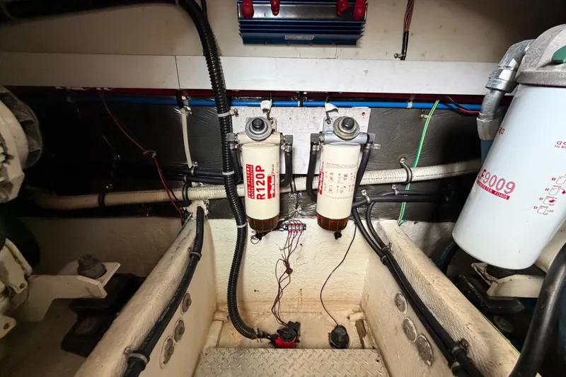 Slide: The Image of Engine room of 2001 Maxum 4600 SCB Limited Edition with fuel filters and wiring. - 45