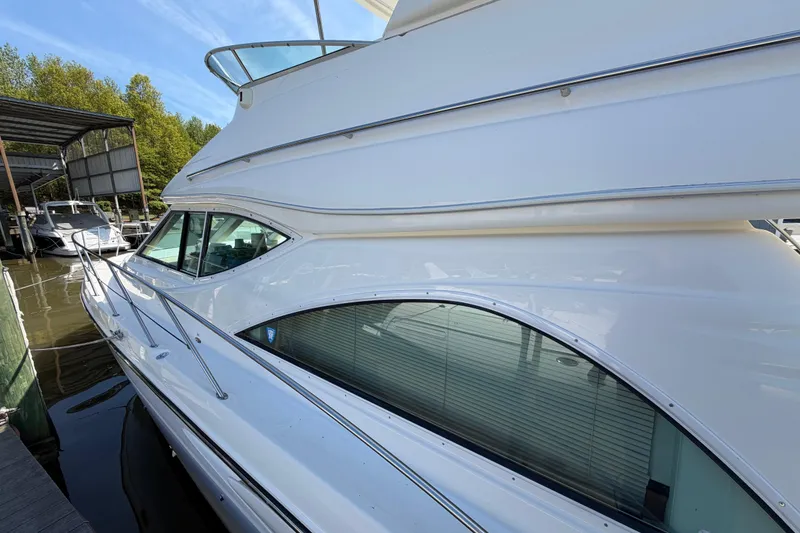 Slide: The Image of 2001 Maxum 4600 SCB Limited Edition yacht docked at marina. - 5