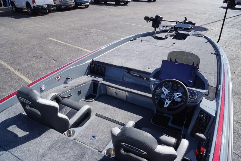 Slide: The Image of 2026 Phoenix 921 Elite X boat interior with steering wheel and seating. - 10