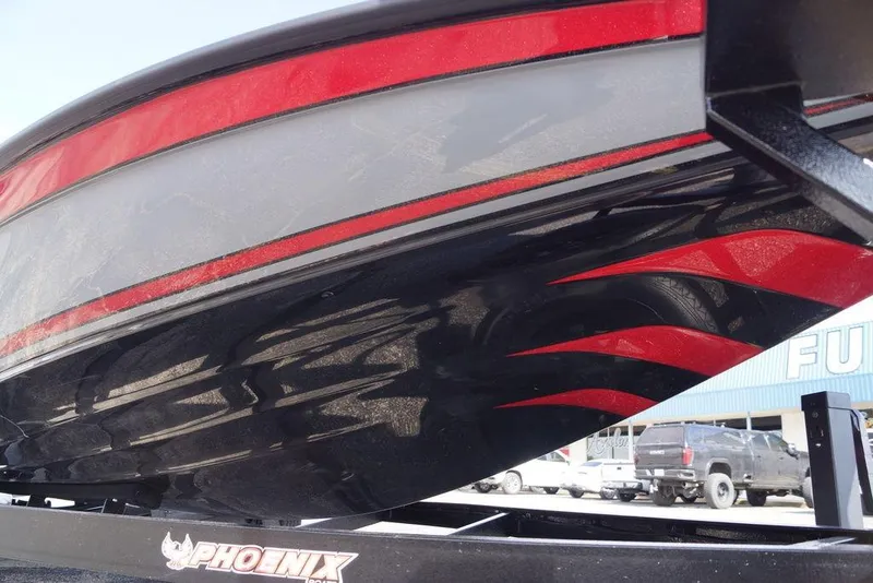 Slide: The Image of 2026 Phoenix 921 Elite X boat with sleek black and red design on trailer. - 11