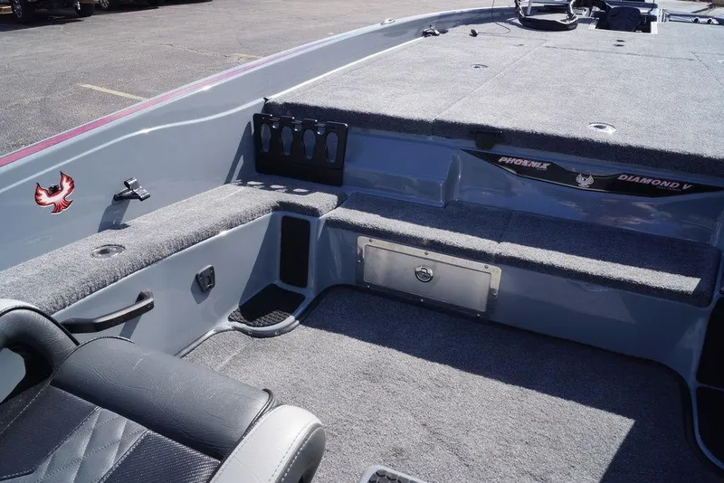 Slide: The Image of Interior of 2026 Phoenix 921 Elite X boat with carpeted seating and storage. - 19