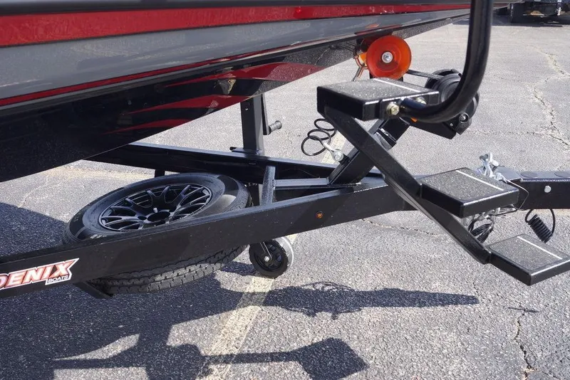 Slide: The Image of Trailer of 2026 Phoenix 921 Elite X boat with black wheel and step ladder. - 4