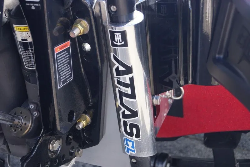 Slide: The Image of Close-up of a 2026 Phoenix 921 Elite X suspension component with warning labels. - 8