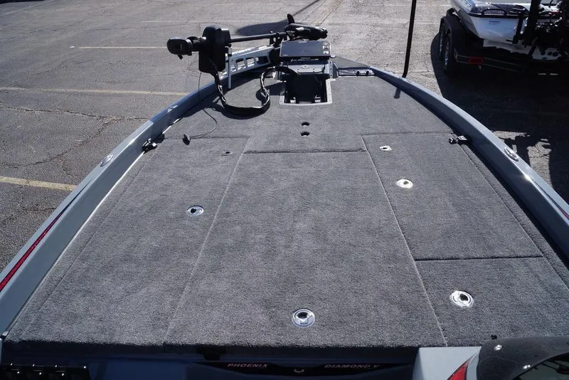 Slide: The Image of 2026 Phoenix 921 Elite X boat deck with carpeted surface and mounted equipment. - 9