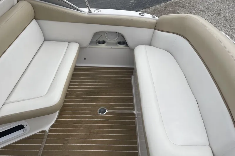 Slide: The Image of 2009 Four Winns V258 boat interior with white and beige seating. - 11