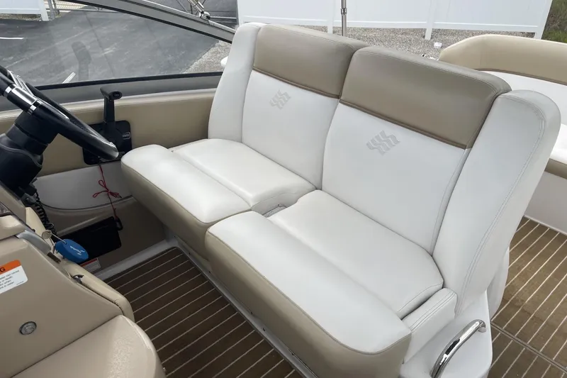 Slide: The Image of 2009 Four Winns V258 boat interior with beige and white seating. - 17