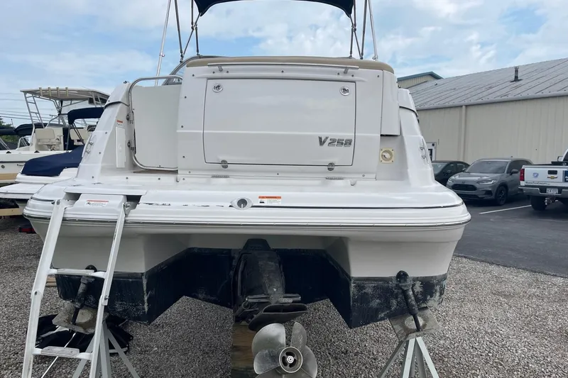 Slide: The Image of 2009 Four Winns V258 boat rear view with ladder and propeller. - 2